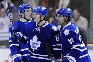 Maple Leafs Grabovski celebrates his game winning goal with Kulemin and MacArthur against the Penguins during their NHL hockey game in Toronto