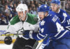 TORONTO, ON - NOVEMBER 2: Morgan Rielly #44 of the Toronto Maple Leafs battles with Jamie Benn #14 of the Dallas Stars during NHL game action November 2, 2015 at Air Canada Centre in Toronto, Ontario, Canada. (Photo by Graig Abel/NHLI via Getty Images)