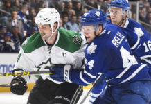 TORONTO, ON - NOVEMBER 2: Morgan Rielly #44 of the Toronto Maple Leafs battles with Jamie Benn #14 of the Dallas Stars during NHL game action November 2, 2015 at Air Canada Centre in Toronto, Ontario, Canada. (Photo by Graig Abel/NHLI via Getty Images)