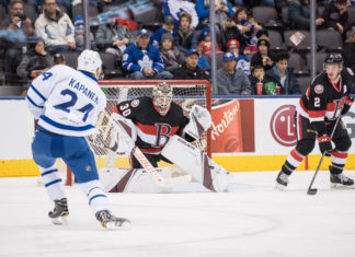 Kasperi Kapanen of the Toronto Marlies tries to beat Andrew Hammond of the Belleville Senators