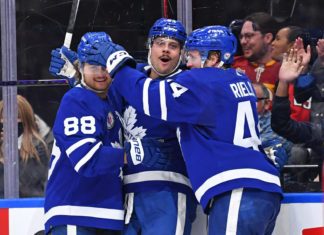 Auston Matthews, Morgan Rielly, William Nylander celebrate a Toronto Maple Leafs goal