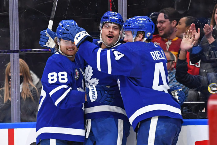 Auston Matthews, Morgan Rielly, William Nylander celebrate a Toronto Maple Leafs goal